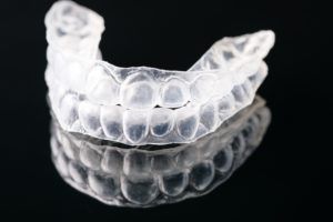 Clear aligners on a black background
