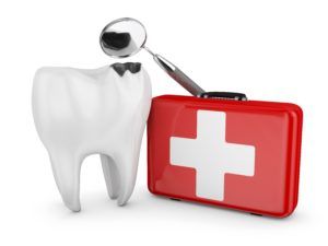 Giant tooth next to a first aid kit