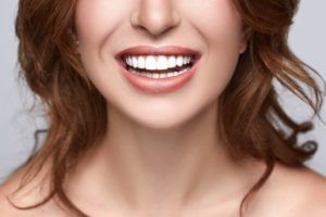 lower half of woman smiling